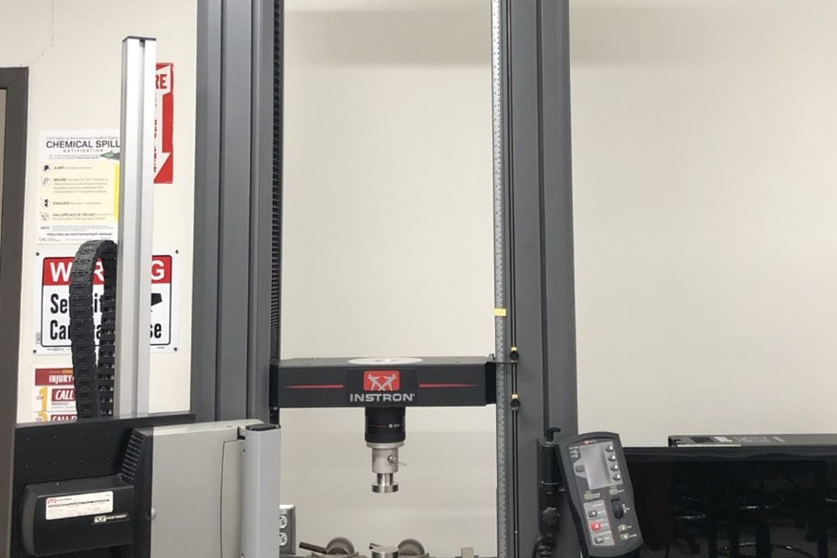 Instron universal testing machine for tensile and flexural strength testing