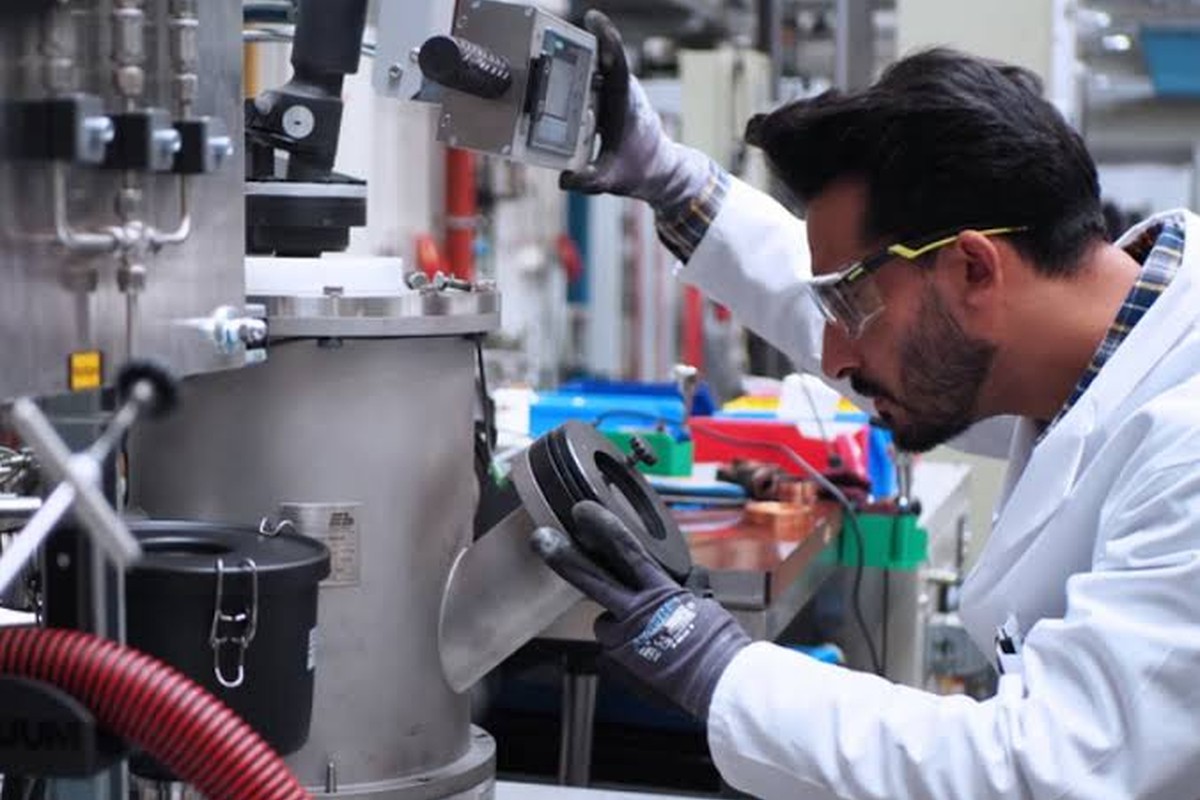 Technician operating in-house laboratory testing equipment